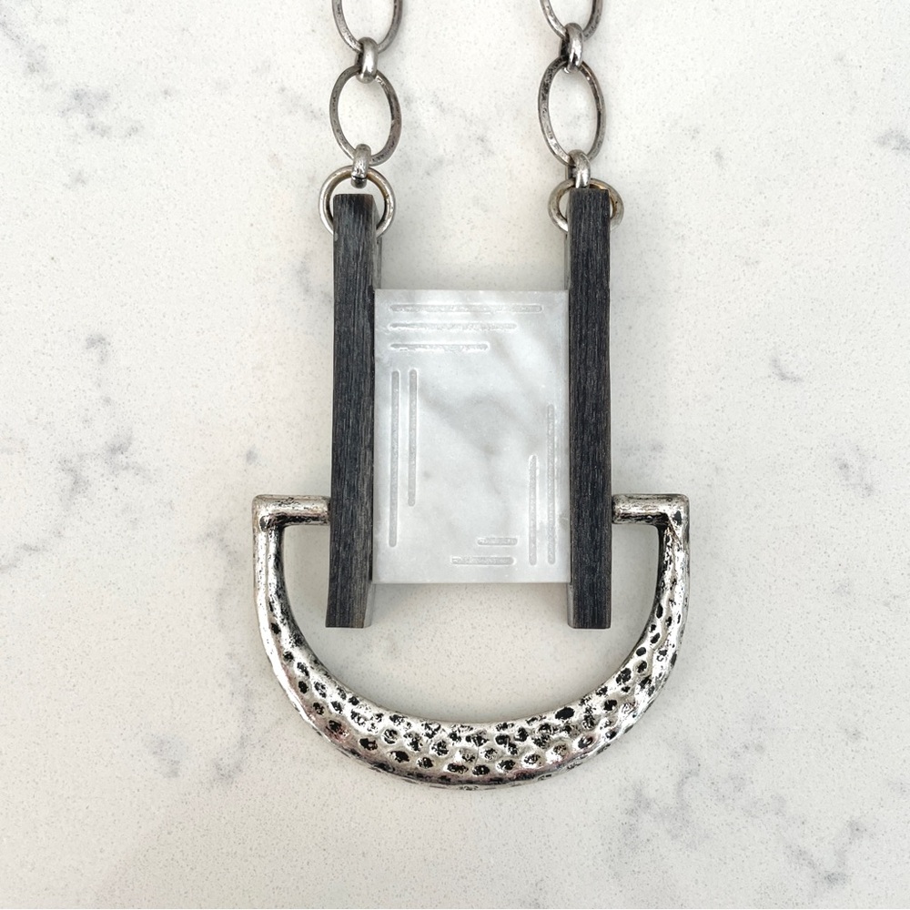 Handcrafted Noonday necklace with stone, wood, and silver metal.